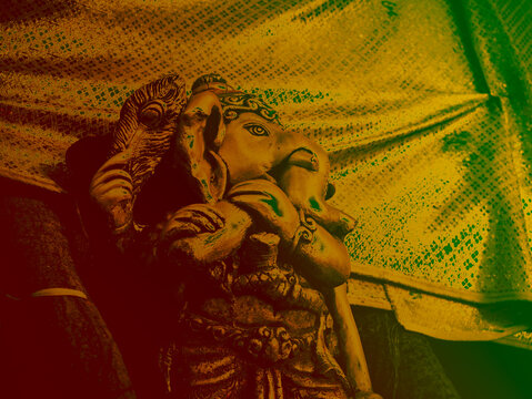 Hindu Elephant God Sculpture with Artistic Yellow Green Red Gradient Color Grading