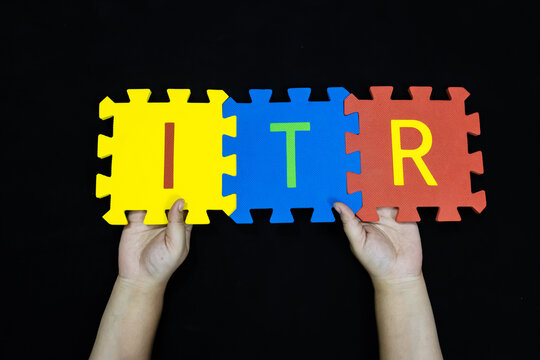 finance and taxation word itr on colorful puzzle pieces