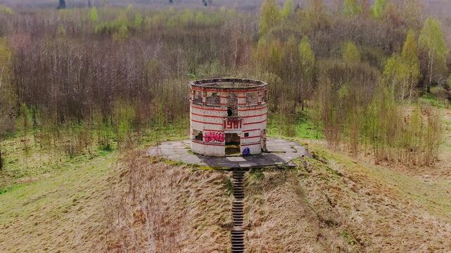 Cold War era tower stands in forest ruins symbolizing power, decay and time