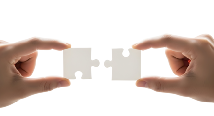 Hands gently connecting two white puzzle pieces on a clean background, embodying partnership, solution, teamwork, and the successful integration of ideas to form a complete whole