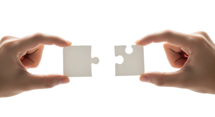 Two hands precisely align and connect two white jigsaw puzzle pieces, symbolizing successful integration of ideas, collaborative problem-solving, partnership, and project completion