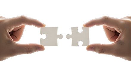 Close-up of human hands about to connect two interlocking jigsaw puzzle pieces, representing synergy, completion, business strategy, and finding the perfect solution for integration