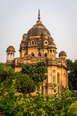 Classic Indian Architecture Building with Mughal Dome Surrounded by Green Garden