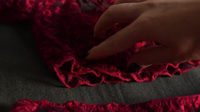 Women's set of erotic and beautiful lingerie. Red top and thong with red lace. Elegant gift