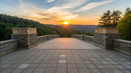 Stone bridge walkway leading to a vibrant sunset over a forested valley