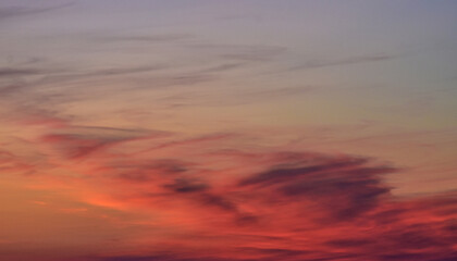 Golden sunset sky with vivid orange, red, and purple clouds