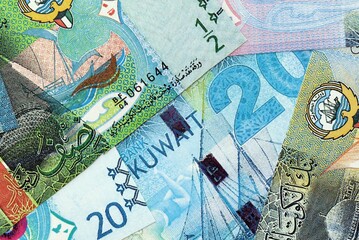 Kuwaiti dinar currency money bills. The current banknotes lies on table in big amount close up