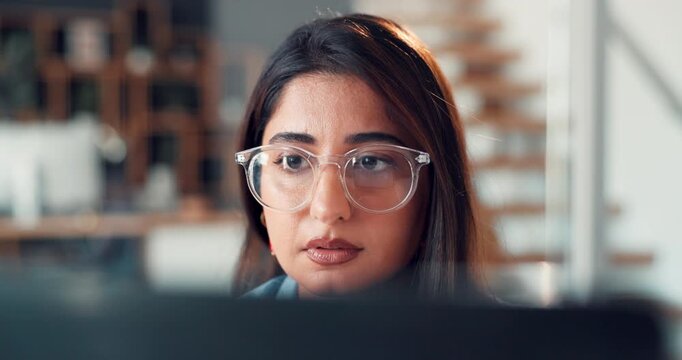Glasses, computer and businesswoman in office with research for creative project with online email. Laptop, reading and female magazine editor with article for publishing in workplace for startup.