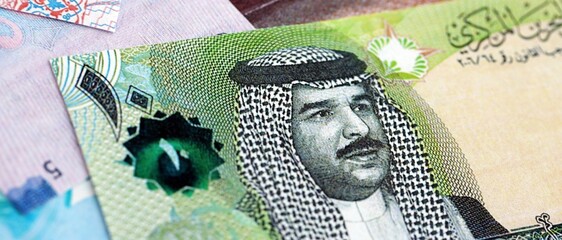Bahraini dinar currency money bills. The current banknotes lies on table in big amount close up