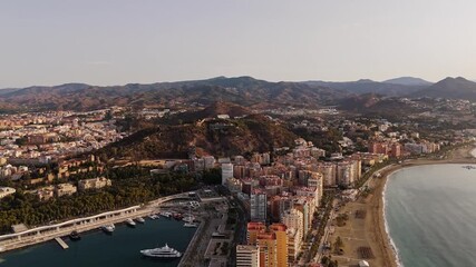 Aerial Landscape views of Malaga coastal city on the Costa del Sol. Malaga is a historical province in southern Spain's Andalusia region. Ambient drone exploration.