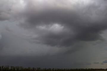 Dark sky with thunderclouds. Stormy sky. Gloomy photo