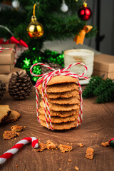 Handmade cookies wrapped with festive rope, capturing the spirit of Christmas and New Year  perfect as heartfelt gift in cozy vertical holiday photo concept.