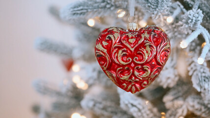 Frosted Christmas tree glowing lights red heart festive holiday background, cozy winter decoration, New Year celebration detail, sparkling seasonal decor, traditional Xmas mood, joyful festive 