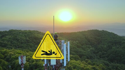 Person working high with an animated warning sign indicating a risk of falling