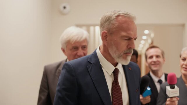Adult Caucasian male politician avoiding giving statement to press after conference, symbolizing discretion, professionalism, and media control
