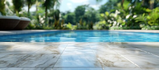 Serene poolside ambiance with marble tiles and lush tropical greenery