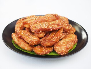 Fried bananas on a plate, a delicious Thai dessert.