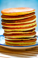 Freshly tasty stack of pancakes on the plate. Delicious homemade breakfast