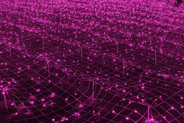 Abstract futuristic background of pink LED lights arranged in grid pattern, network, glowing in dark night atmosphere. Bokeh textured backdrop shining on dark, festive holiday texture for design.