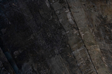 Protective netting spans a weathered stone ceiling inside angkor wat temple in siem reap, cambodia