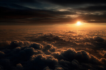 Glowing sunset above dramatic sea of clouds at high altitude