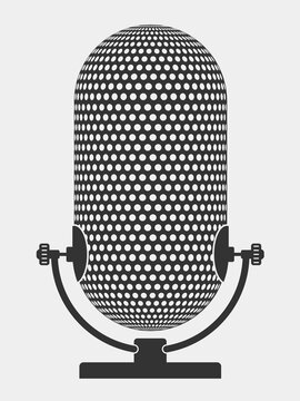 A microphone for an acoustic system. The microphone stands on a table. The microphone is minimalist in style.