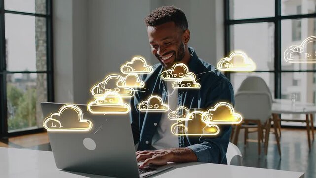 Smiling man using laptop with glowing digital cloud computing icons, modern office background, technology innovation, digital connection concept