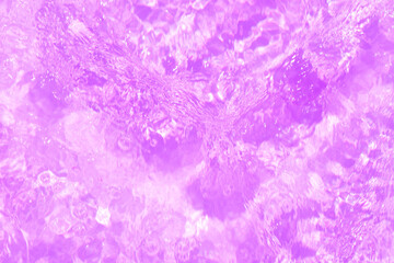 Pink marble texture. Pink water bubbles on the surface ripples. Defocus blurred transparent pink colored clear calm water surface texture with splash and bubbles. Water waves with shining pattern text