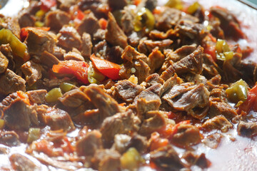 Savory beef stir fry with peppers and tomatoes