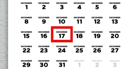 The date December 17th marked with a red cursor on the wall calendar 2025