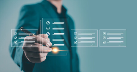 Businessman checking digital checklist on virtual screen, representing task management, workflow approval, online verification, and modern digital business technology modern technology for business