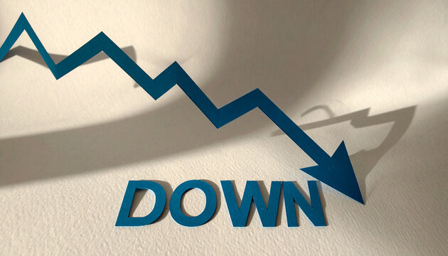 切紙で表現されたグラフが右下へと下降しdownを示すシンプルで強いビジュアル