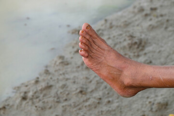 Close up of old man's left leg with dark brown skin. Asian farmer's leg. For graphic design, 3D rendering and banners