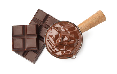 Melted chocolate and pieces isolated on white, top view