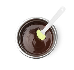 Melted chocolate and spatula in bowl isolated on white, top view