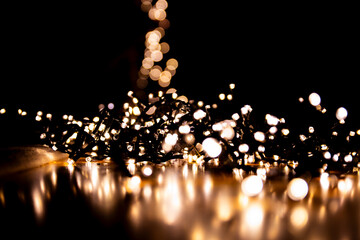 Abstract bokeh lights on a dark background. Christmas magical light, overlay or lens flare effect
