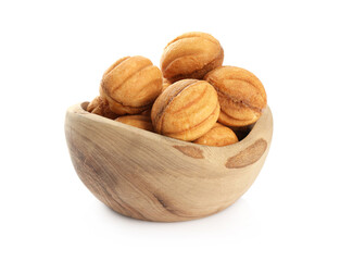Delicious nut shaped cookies with boiled condensed milk in bowl isolated on white