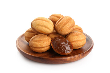 Delicious nut shaped cookies with boiled condensed milk isolated on white