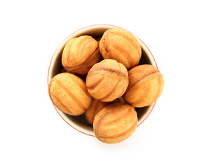 Delicious nut shaped cookies with boiled condensed milk in bowl isolated on white, top view