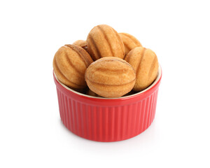 Delicious nut shaped cookies with boiled condensed milk in bowl isolated on white