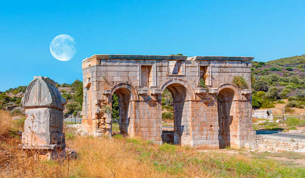 Ancient ruins of gates in Patara - Arch of Modestus in ancient Lycian city Patara - Kas, Antalya, Turkey. - Powered by Adobe