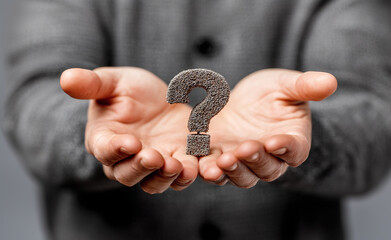 Man Holding Glowing Question Mark Seeking Advice