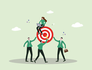 A team collaborates to hold up a target as one member marks the center, symbolizing coordination, teamwork, leadership, and strategy highlighting that true success comes from collective effort.