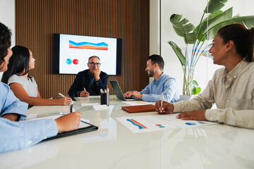Multiracial colleagues working inside business office with glass walls - Entrepreneurs people sharing ideas at teamwork meeting - Brainstorming concept - Main focus on right man face