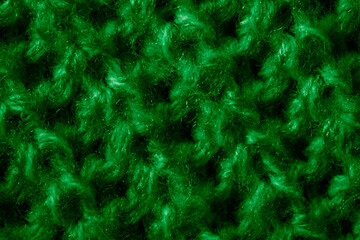 green woolen material with an interesting pattern