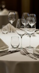 Elegant dining table setting with glassware for formal dinner events