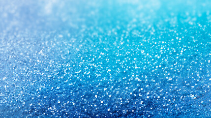 Obraz premium きらめく雪と光が舞う青いグラデーション背景