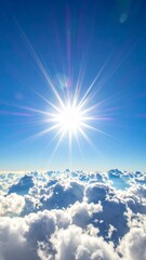 Bright Sun Shining with a Starburst Effect Above a Sea of Clouds.