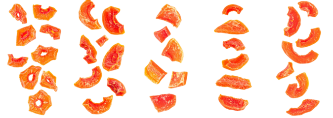 Dried tropical papaya fruit falling, showing vibrant orange and red colors. Representing healthy snacks or sweet ingredients
