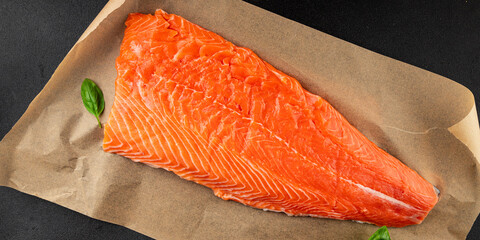 Salmon fillet raw red fish seafood dish natural tasty snack fresh delicious gourmet food background on the table rustic top view copy space pescetarian diet